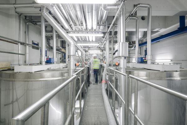 Coating colour kitchen tanks with a walkway and overhead piping